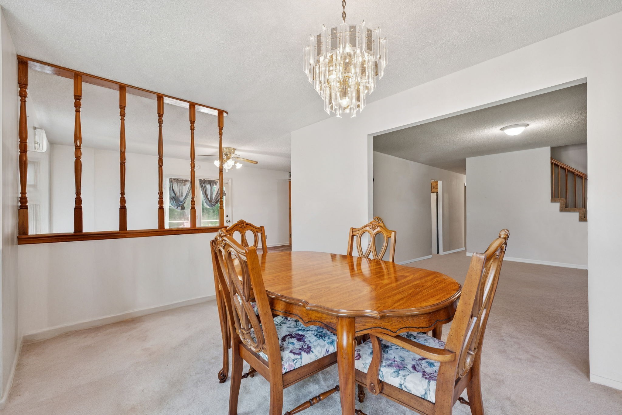 8663 Dog Branch Road Mount Pleasant, TN 38474 - Photo 20 of 42 a dining room with furniture a chandelier and window