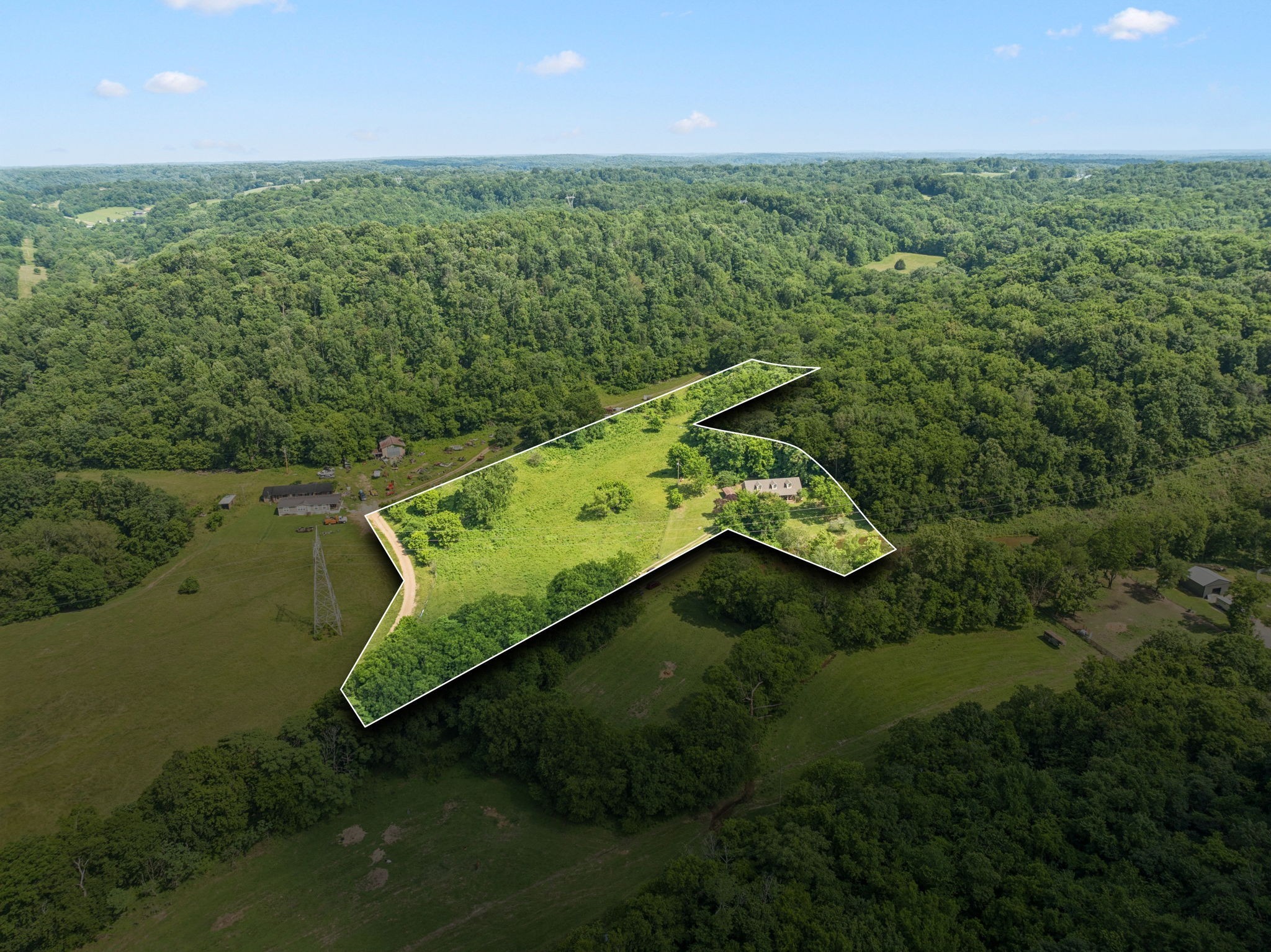 8663 Dog Branch Road Mount Pleasant, TN 38474 - Photo 2 of 42 an aerial view of a house with a yard