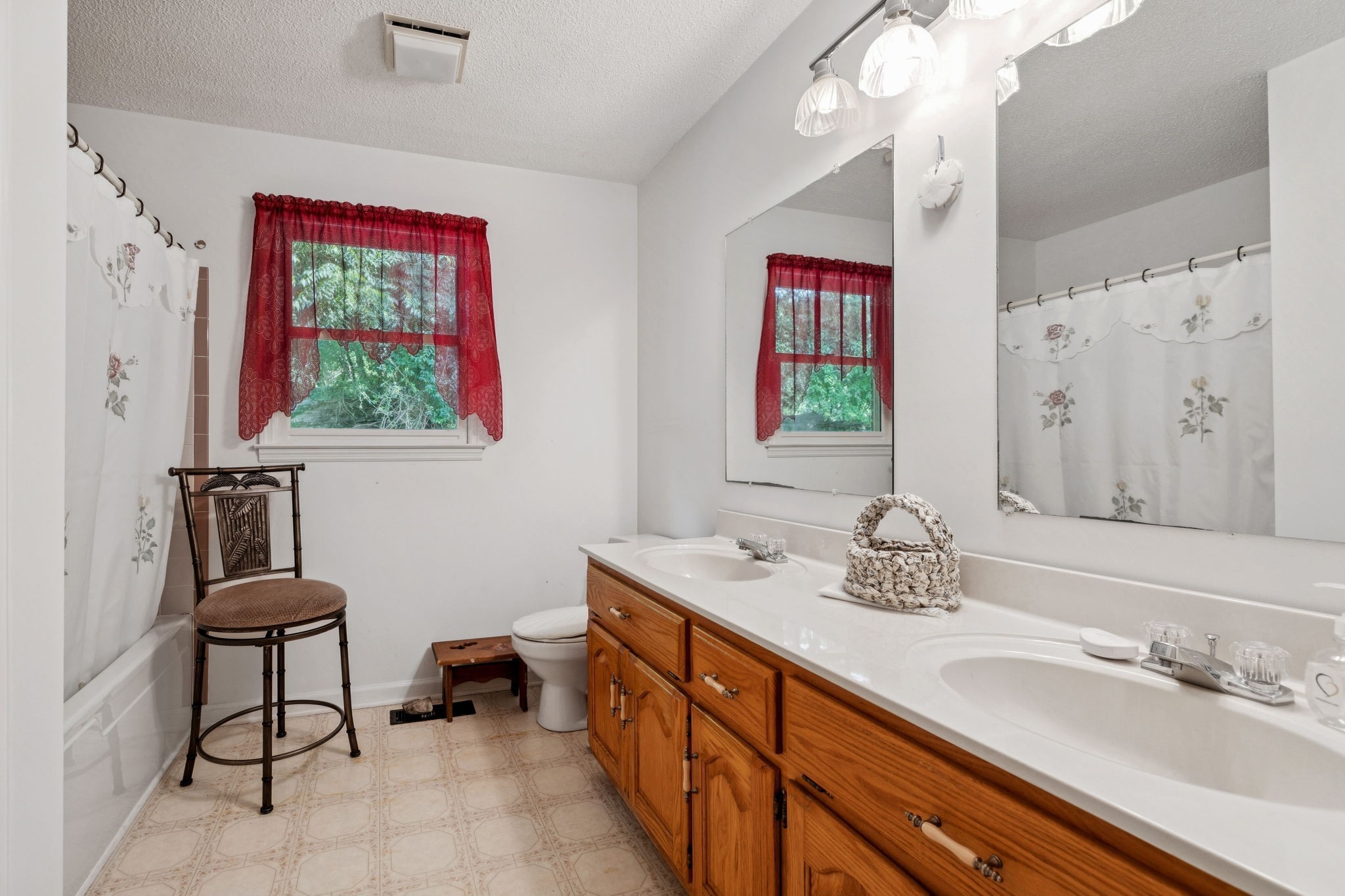 8663 Dog Branch Road Mount Pleasant, TN 38474 - Photo 21 of 42 a spacious bathroom with a granite countertop sink a toilet and a mirror
