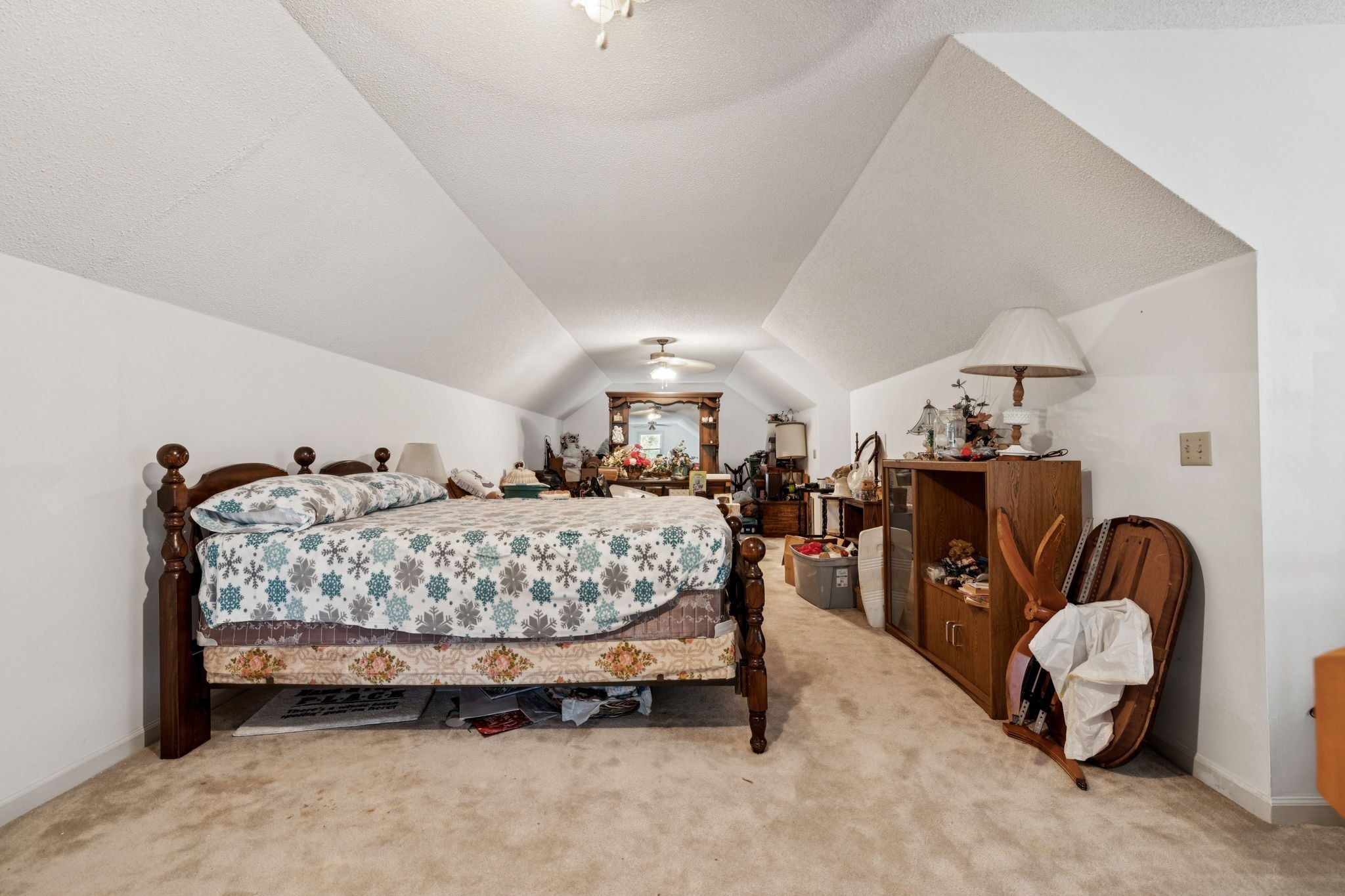 8663 Dog Branch Road Mount Pleasant, TN 38474 - Photo 27 of 42 a bed room with furniture and a chandelier