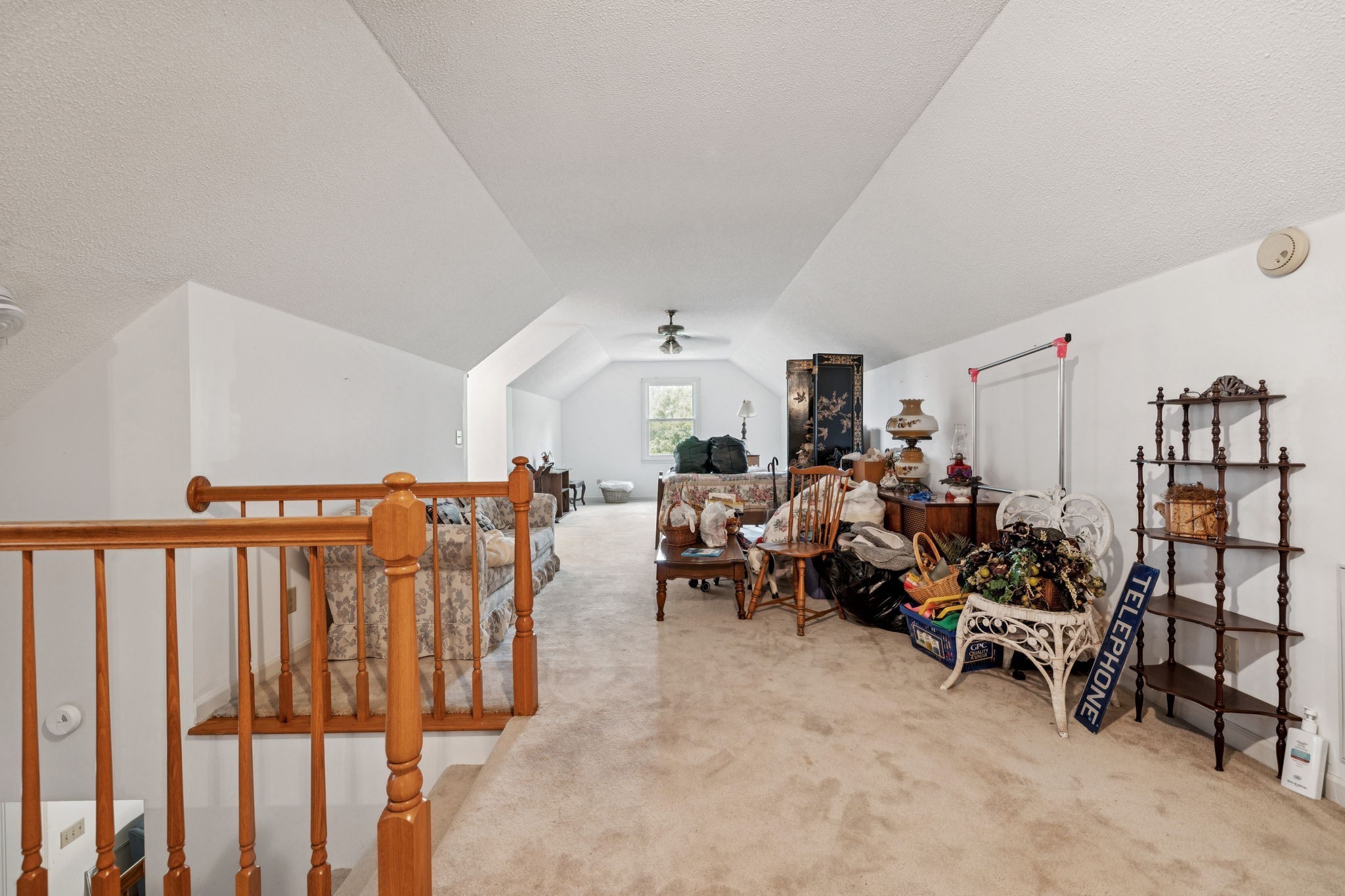 8663 Dog Branch Road Mount Pleasant, TN 38474 - Photo 28 of 42 a living room with lots of furniture and white walls