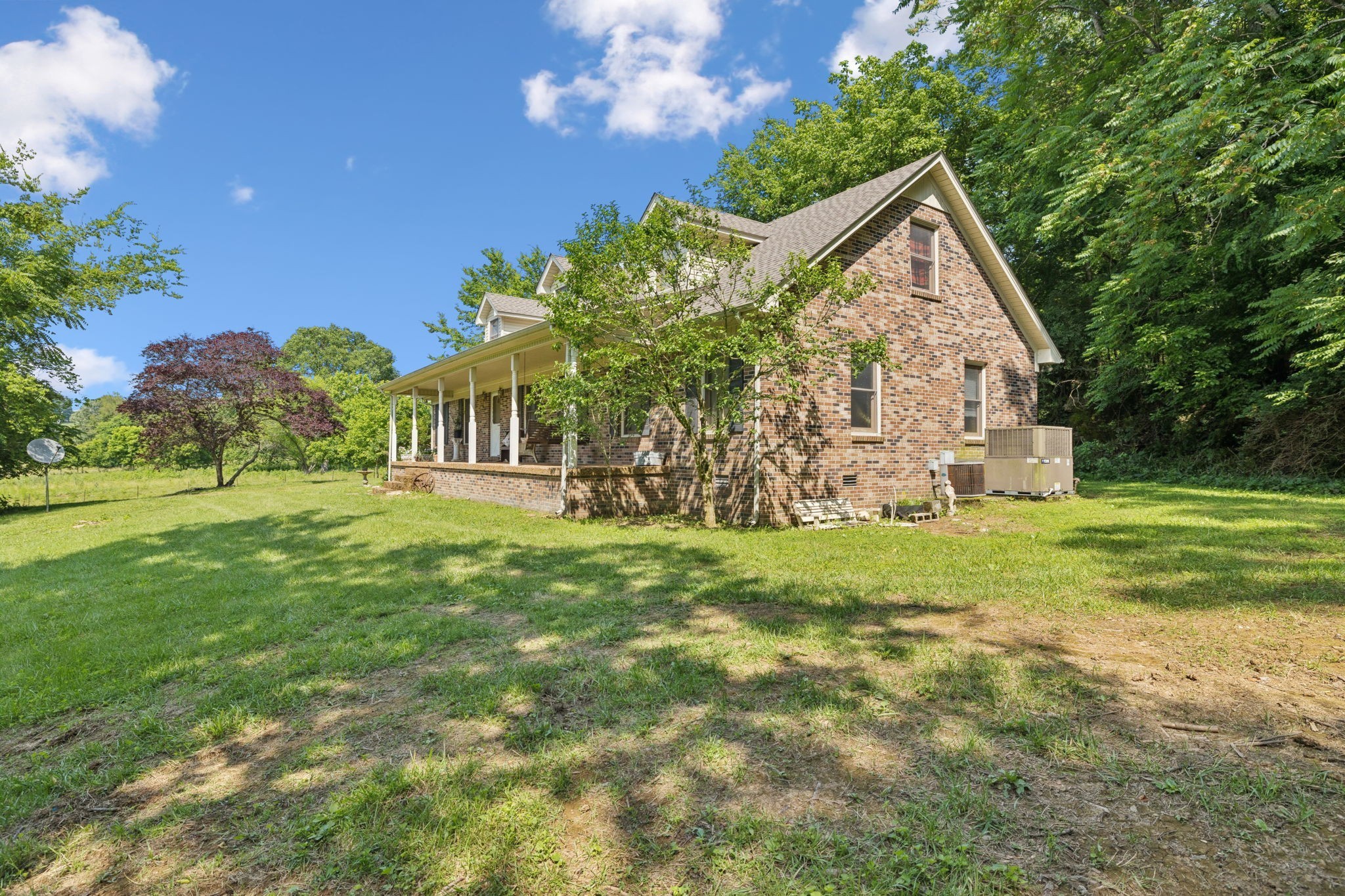 8663 Dog Branch Road Mount Pleasant, TN 38474 - Photo 5 of 42 a front view of a house with garden