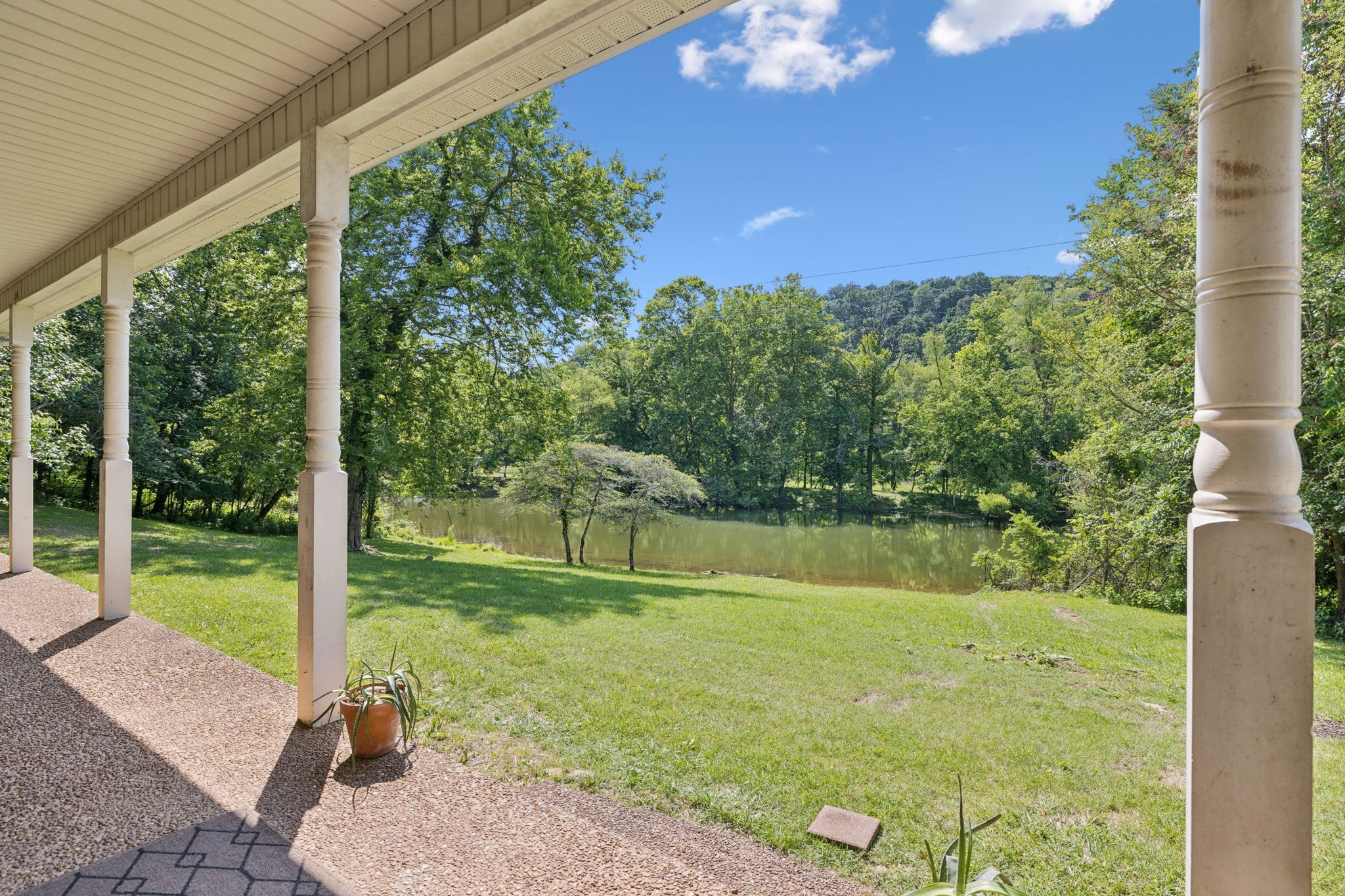 8663 Dog Branch Road Mount Pleasant, TN 38474 - Photo 7 of 42 a view of a garden with a lake