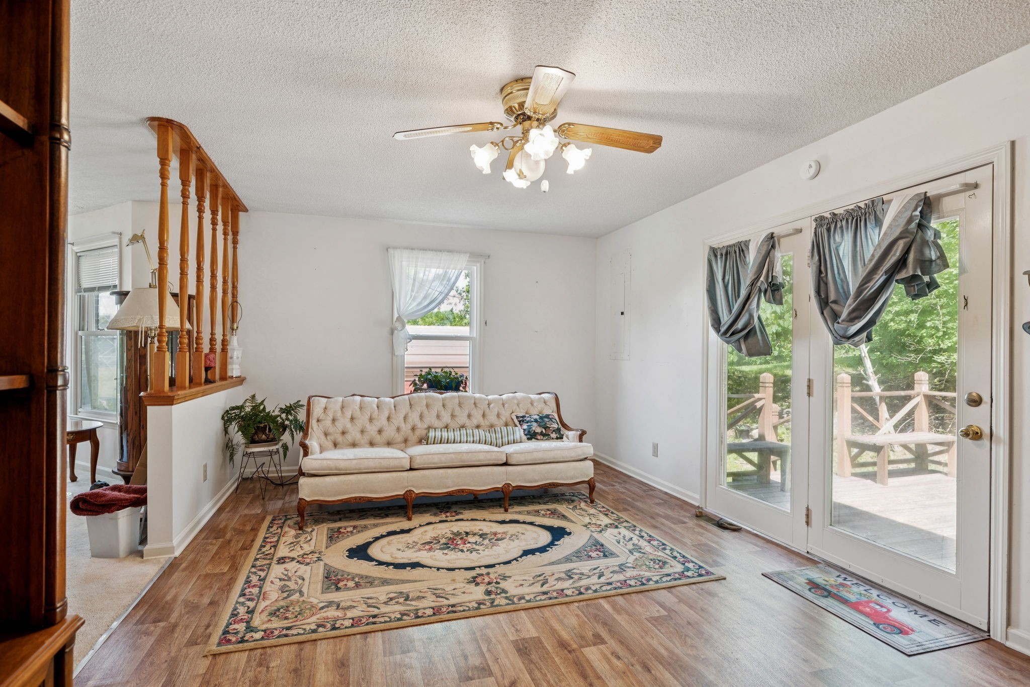 8663 Dog Branch Road Mount Pleasant, TN 38474 - Photo 10 of 42 a spacious bedroom with a bed a chandelier and large window