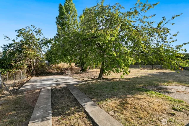 a backyard of a house with lots of green space