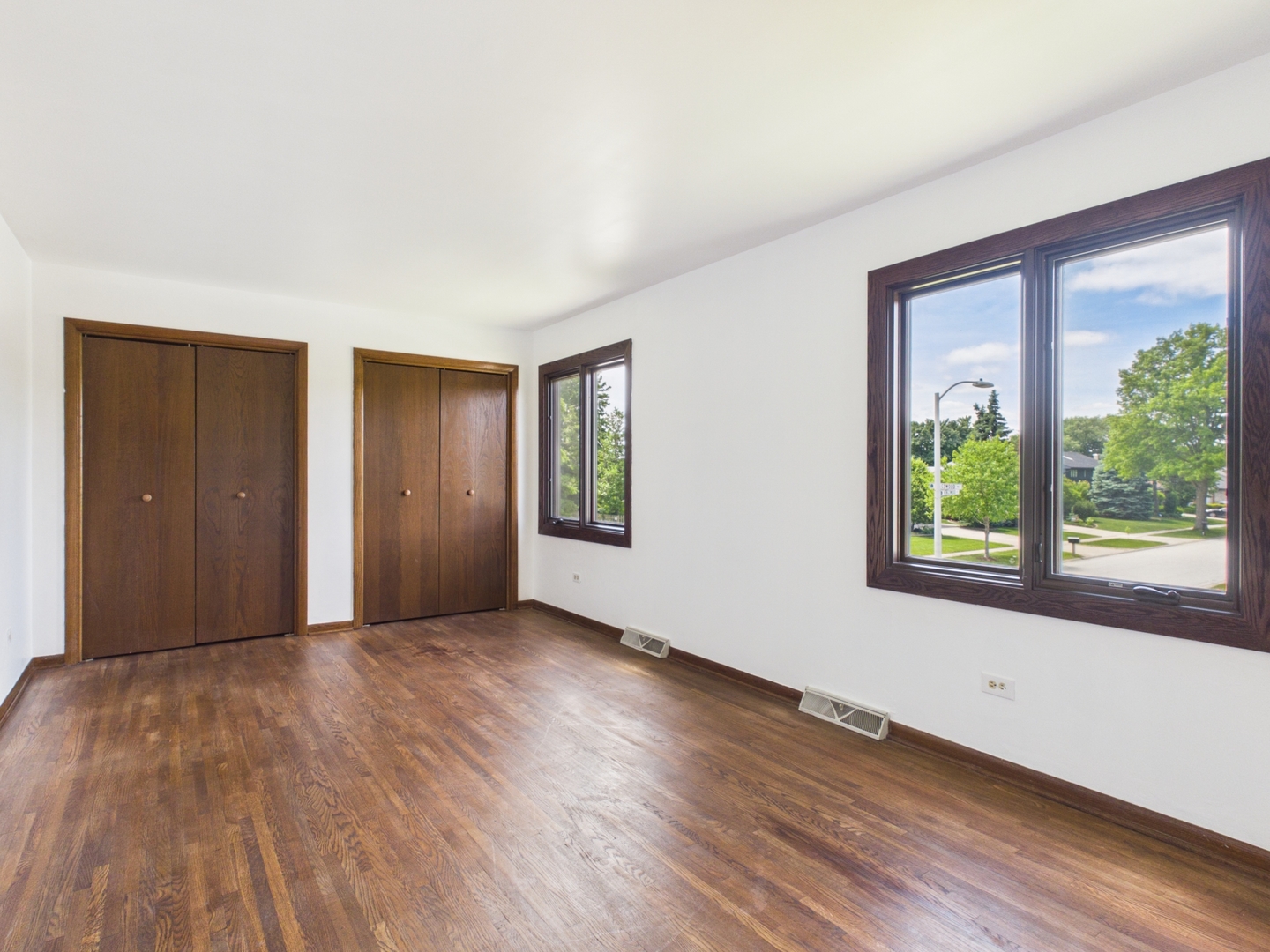 6723 Kingswood Road Willowbrook, IL 60527 - Photo 30 of 51 a view of an empty room with wooden floor and a window