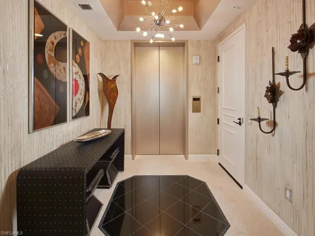 a bathroom with a sink mirror and shower