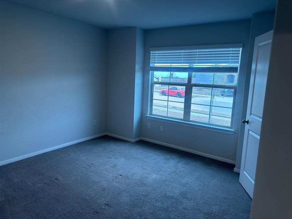 721 Durango Lane Cleburne, TX 76033 - Photo 20 of 25 an empty room with windows