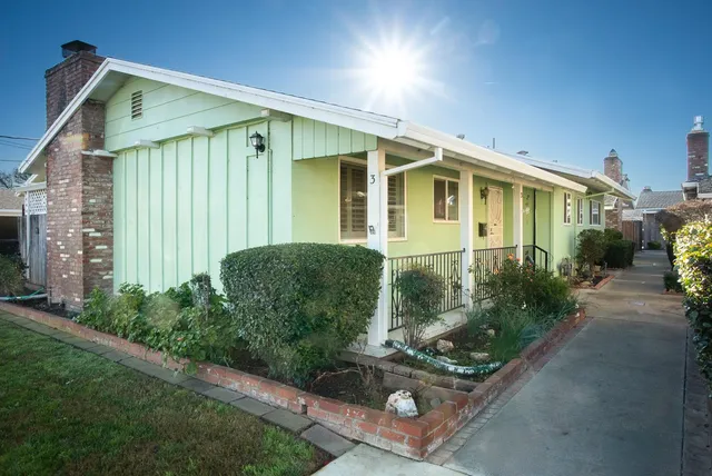 a front view of a house with garden