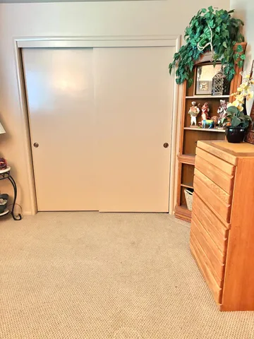 a utility room with mirror and a shower