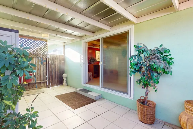 a vase of flowers sitting on a floor