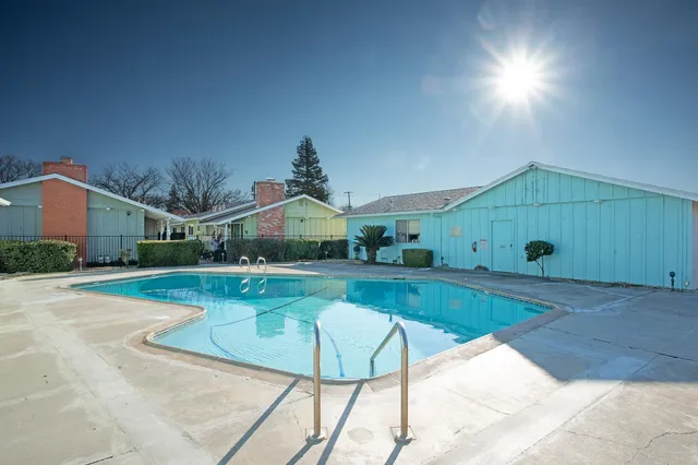 a view of a house with swimming pool