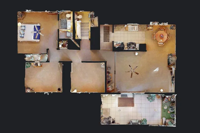 an aerial view of residential houses with outdoor space and parking