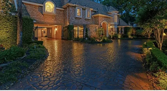 a front view of a house with lots of green space