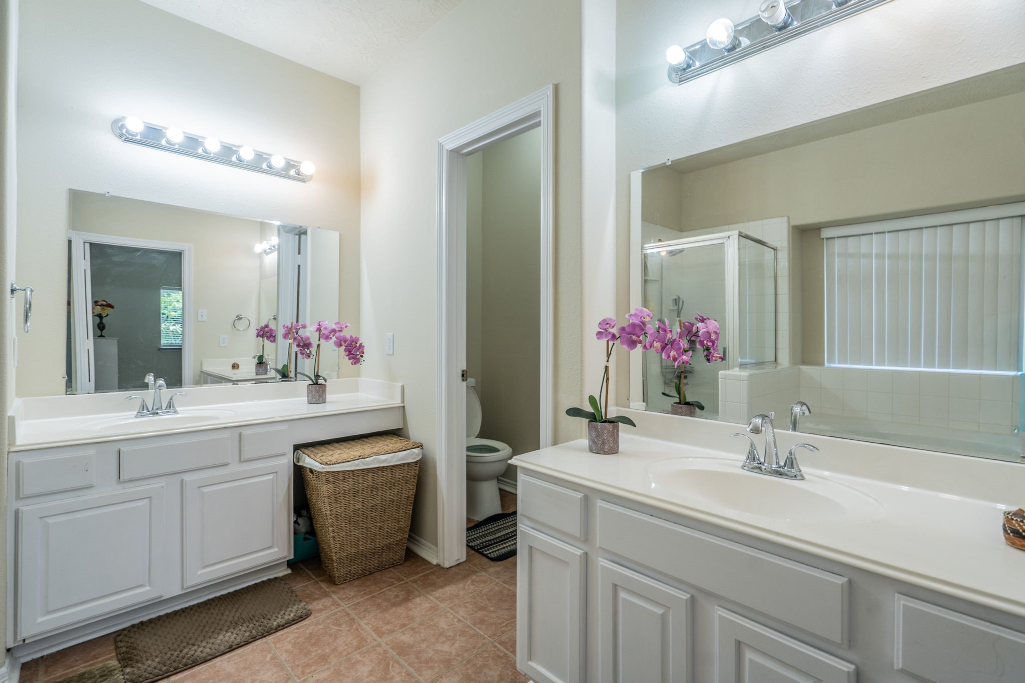 24139 Spring Sunset Drive Spring, TX 77373 - Photo 15 of 26 a bathroom with a sink and a mirror