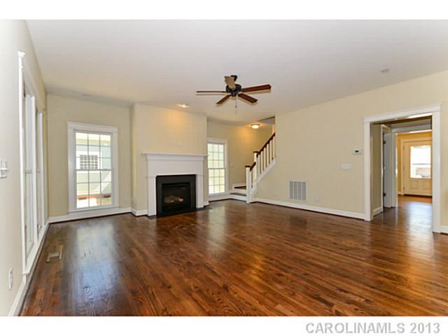 812 Elswick Court, Unit 1333 Fort Mill, SC 29708 - Photo 11 of 16 a view of a livingroom with wooden floor and a fireplace