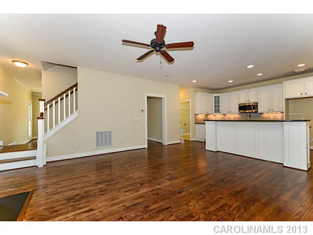 812 Elswick Court, Unit 1333 Fort Mill, SC 29708 - Photo 12 of 16 a view of a kitchen with wooden floor and a ceiling fan