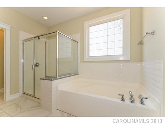 812 Elswick Court, Unit 1333 Fort Mill, SC 29708 - Photo 14 of 16 a bathroom with a bathtub and a shower