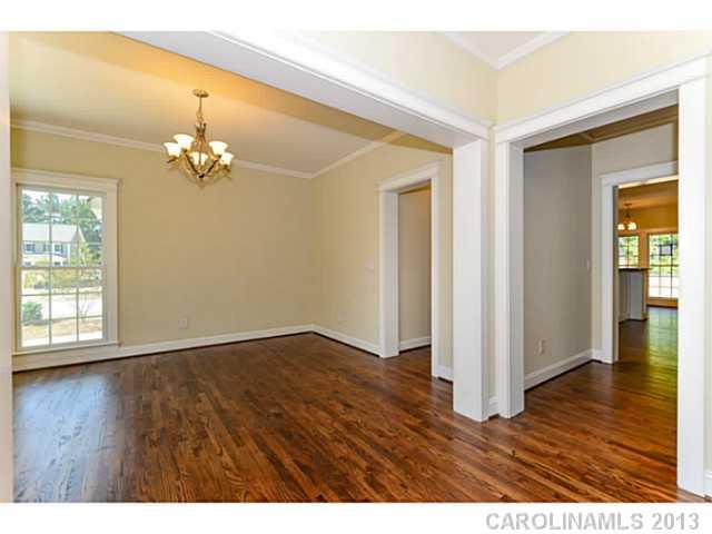 812 Elswick Court, Unit 1333 Fort Mill, SC 29708 - Photo 5 of 16 a view of an empty room with wooden floor and a window