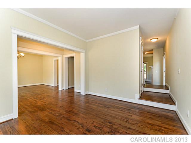 812 Elswick Court, Unit 1333 Fort Mill, SC 29708 - Photo 7 of 16 a view of an empty room with wooden floor and a window