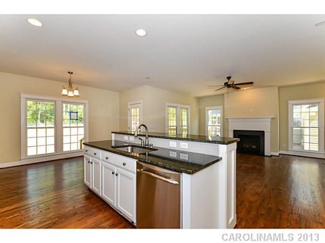 812 Elswick Court, Unit 1333 Fort Mill, SC 29708 - Photo 9 of 16 a kitchen with a sink and chandelier