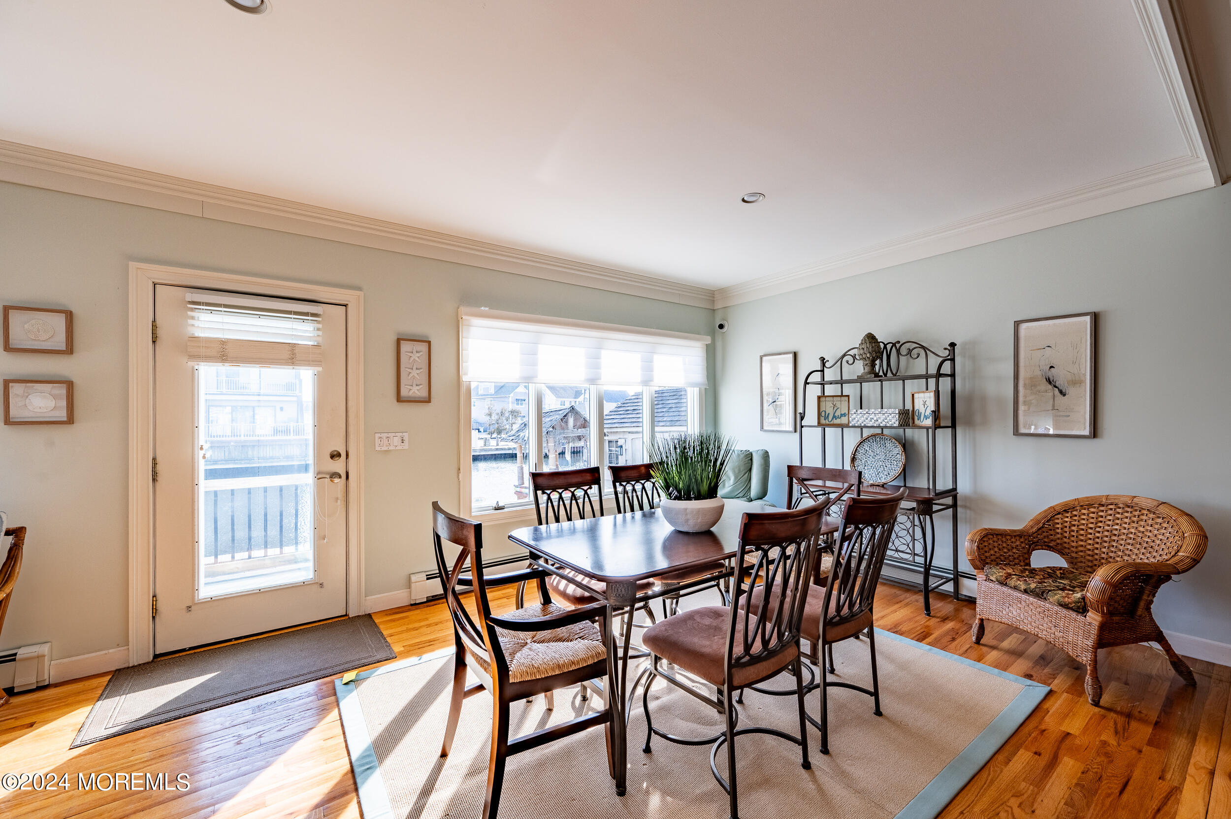 409 6th Avenue Seaside Heights, NJ 08751 - Photo 17 of 39 a dining room with furniture and wooden floor
