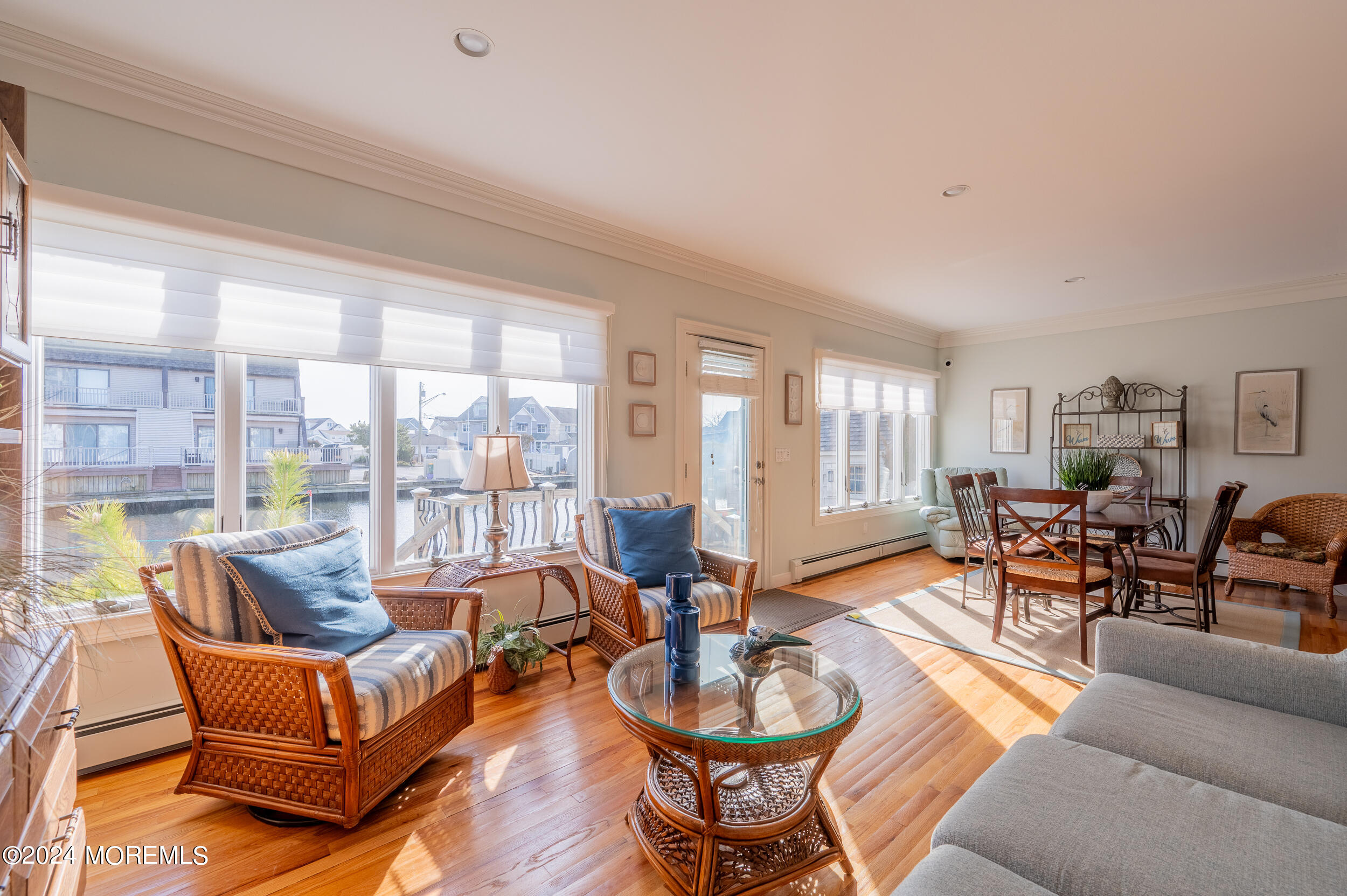 409 6th Avenue Seaside Heights, NJ 08751 - Photo 18 of 39 a living room with furniture a fireplace and large windows
