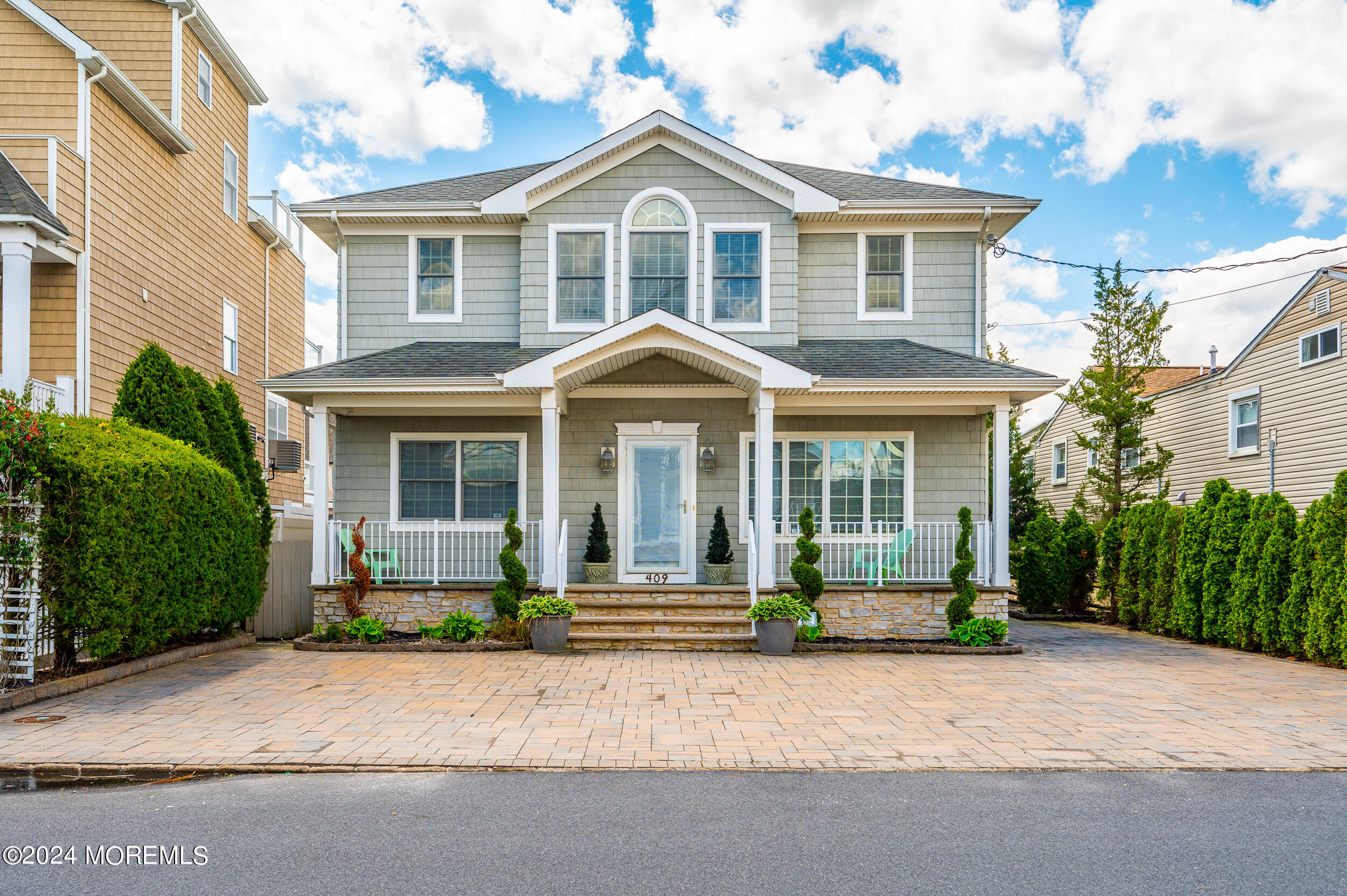 409 6th Avenue Seaside Heights, NJ 08751 - Photo 2 of 39 a front view of a house with a garden