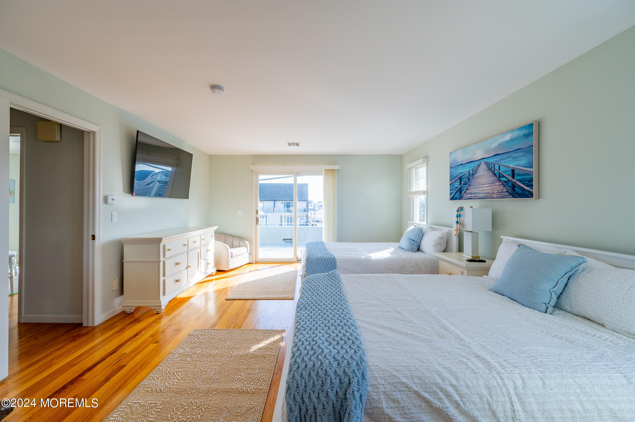 409 6th Avenue Seaside Heights, NJ 08751 - Photo 29 of 39 a bedroom with a bed and a flat screen tv