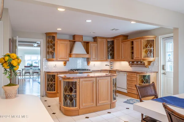 a kitchen with a sink cabinets and window