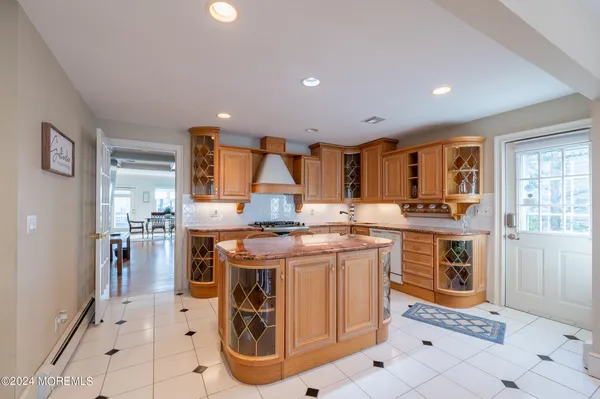 a kitchen with stainless steel appliances granite countertop a stove and a sink