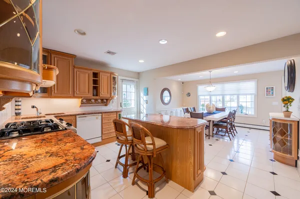 a kitchen with a table and chairs in it