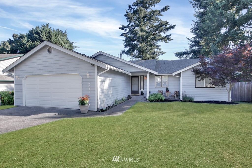 5624 Hazel Loop Southeast Auburn, WA 98092 - Photo 1 of 16 a view of a house with a yard and pathway