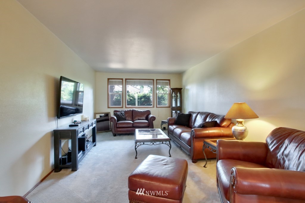 5624 Hazel Loop Southeast Auburn, WA 98092 - Photo 4 of 16 a living room with furniture and a flat screen tv
