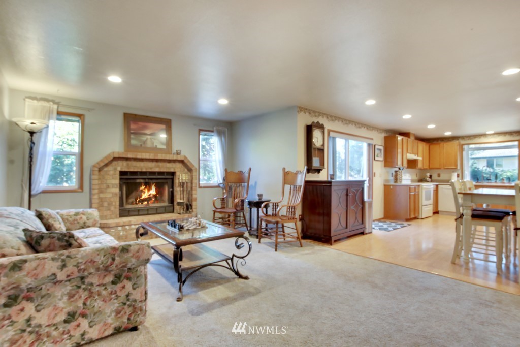 5624 Hazel Loop Southeast Auburn, WA 98092 - Photo 7 of 16 a living room with furniture and a fireplace