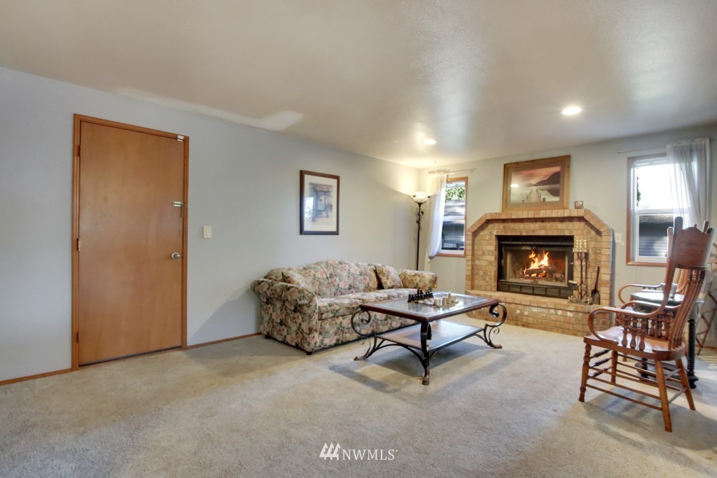5624 Hazel Loop Southeast Auburn, WA 98092 - Photo 8 of 16 a living room with furniture and a fireplace
