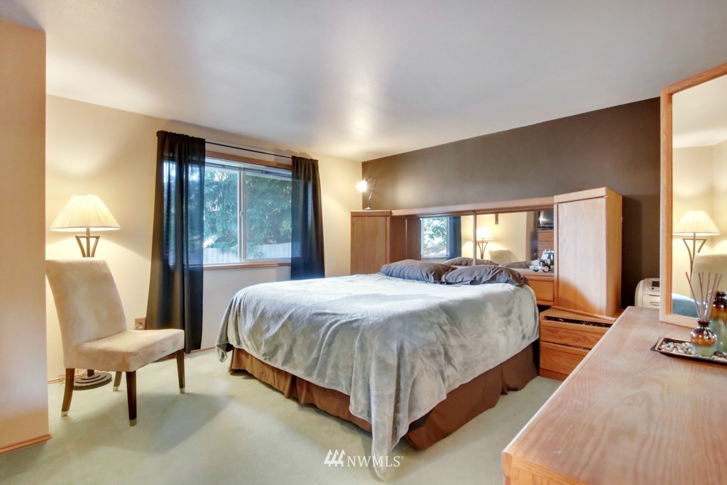 5624 Hazel Loop Southeast Auburn, WA 98092 - Photo 10 of 16 a spacious bedroom with a bed and a window