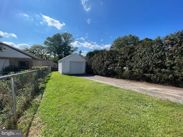 a picture of a room with a white wall and a picture