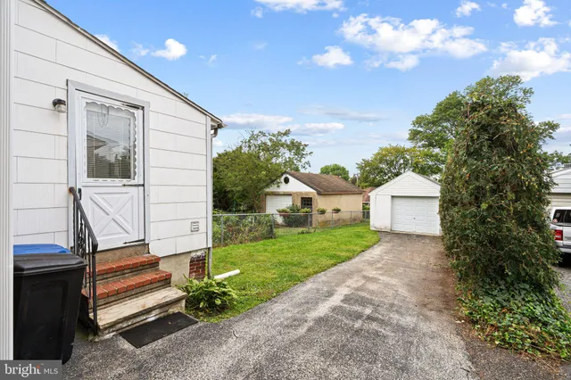 a picture of a bench in front of a wall
