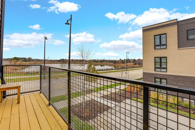 a view of balcony with wooden floor