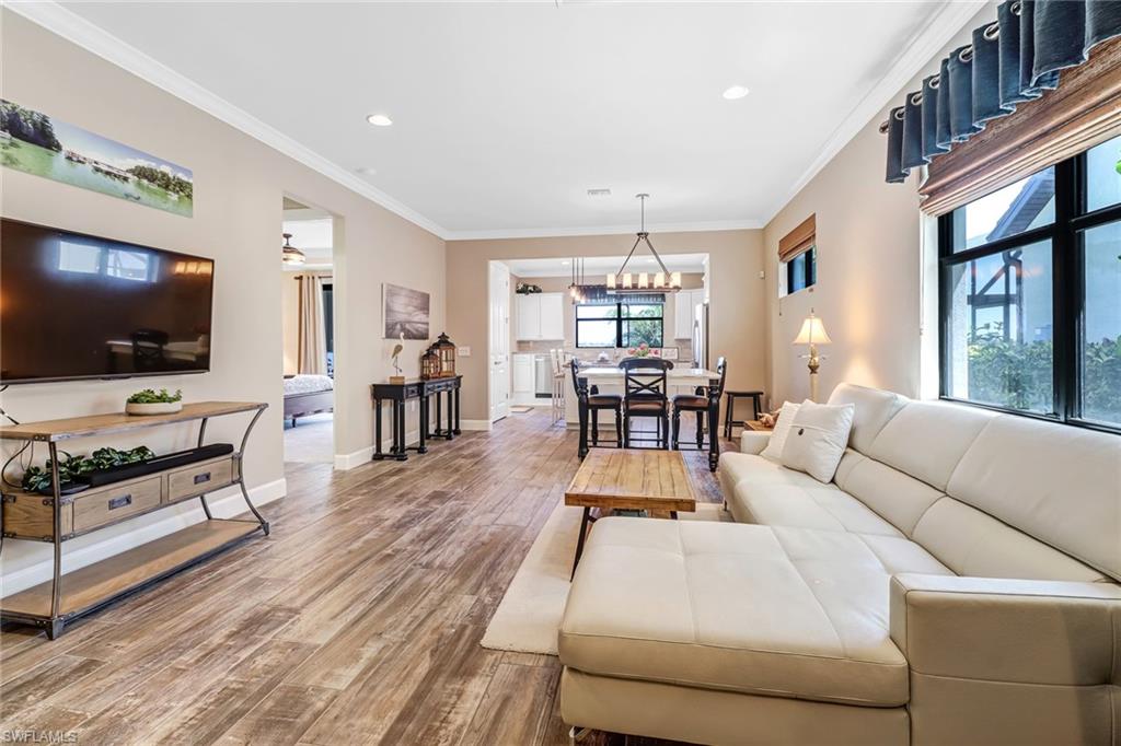 20321 Corkscrew Shores Boulevard Estero, FL 33928 - Photo 12 of 38 a living room with furniture and a flat screen tv