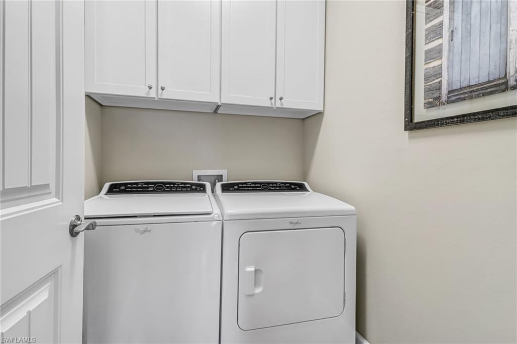 20321 Corkscrew Shores Boulevard Estero, FL 33928 - Photo 22 of 38 a view of storage and utility room with washer and dryer