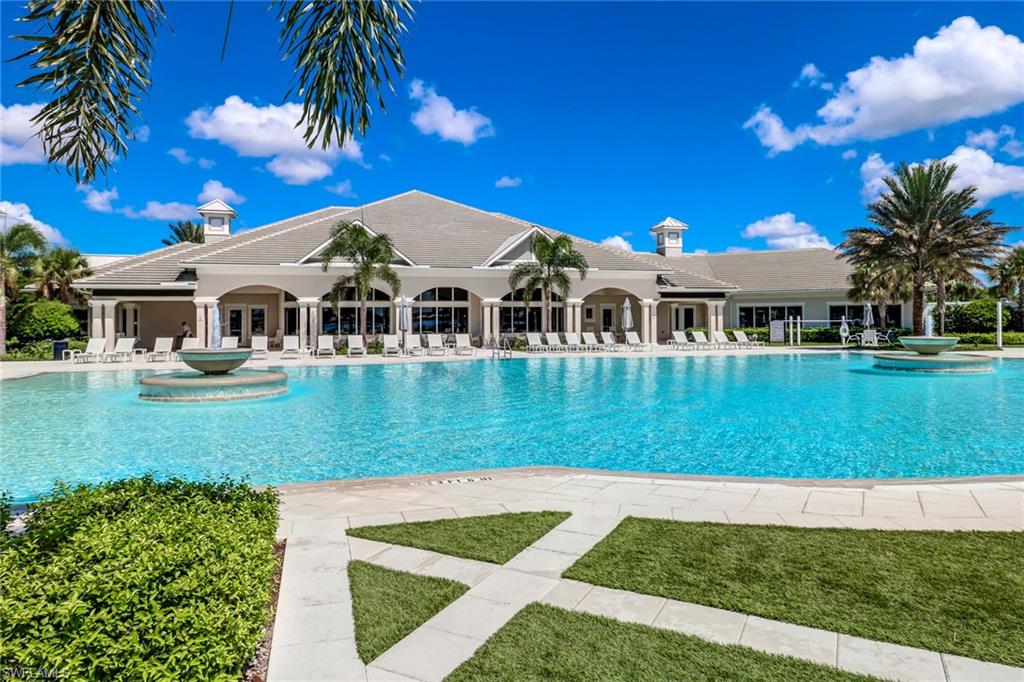 20321 Corkscrew Shores Boulevard Estero, FL 33928 - Photo 26 of 38 a view of a house with a backyard porch and sitting area