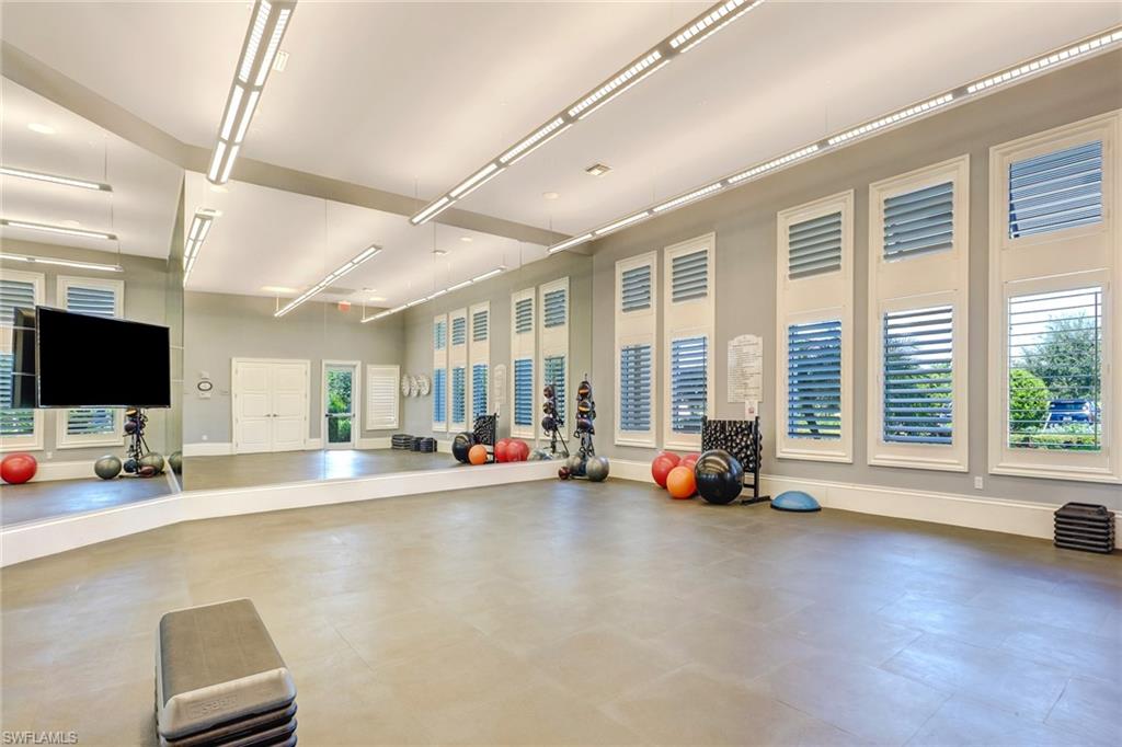 20321 Corkscrew Shores Boulevard Estero, FL 33928 - Photo 38 of 38 a view of a work space with windows and lounge chairs