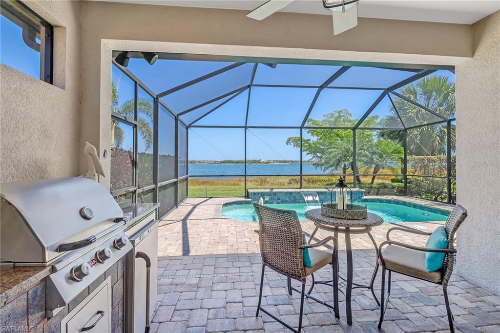 20321 Corkscrew Shores Boulevard Estero, FL 33928 - Photo 4 of 38 a view of a chairs and table in a patio