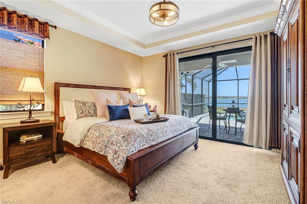 20321 Corkscrew Shores Boulevard Estero, FL 33928 - Photo 5 of 38 a bed sitting in a spacious bedroom next to a window
