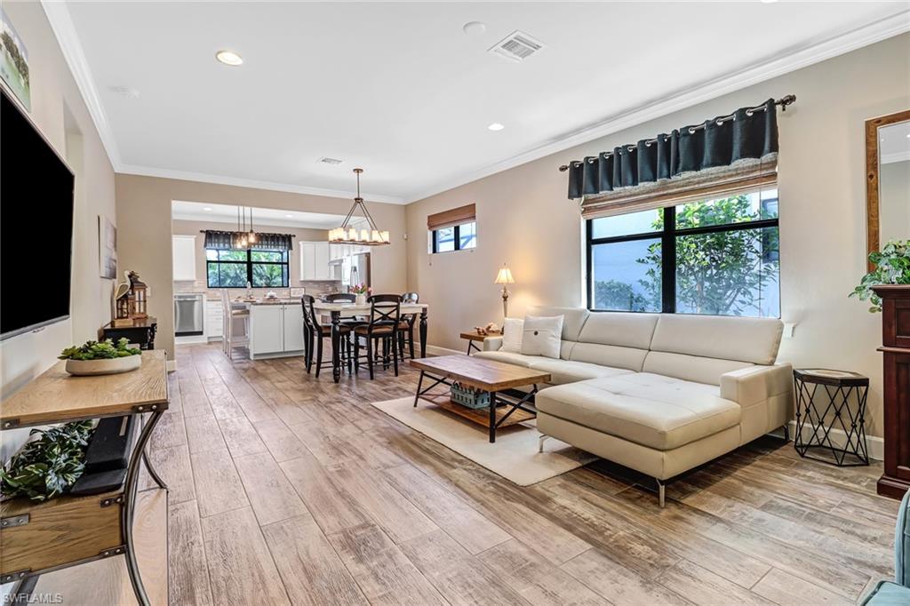 20321 Corkscrew Shores Boulevard Estero, FL 33928 - Photo 6 of 38 a living room with furniture and a flat screen tv