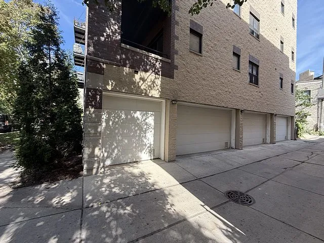 a view of entrance gate of building and trees