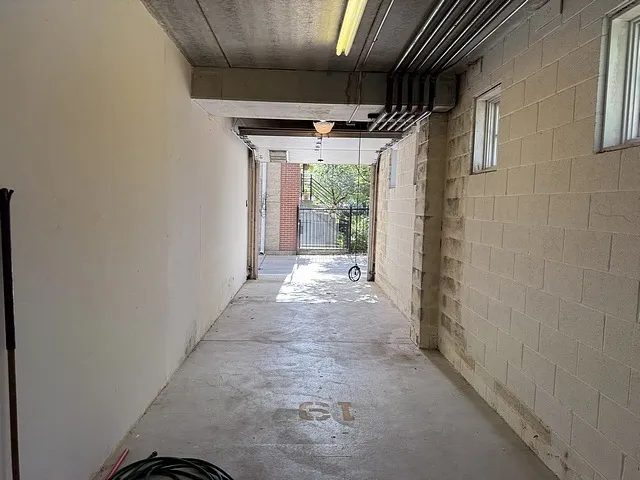 a backyard of a house with garden and outdoor seating