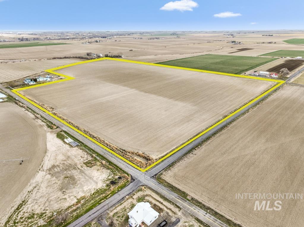 3900 North (52 /- Acres) Filer, ID 83328 - Photo 1 of 29 Overview of rural landscape with rows of crops and property boundaries highlighted